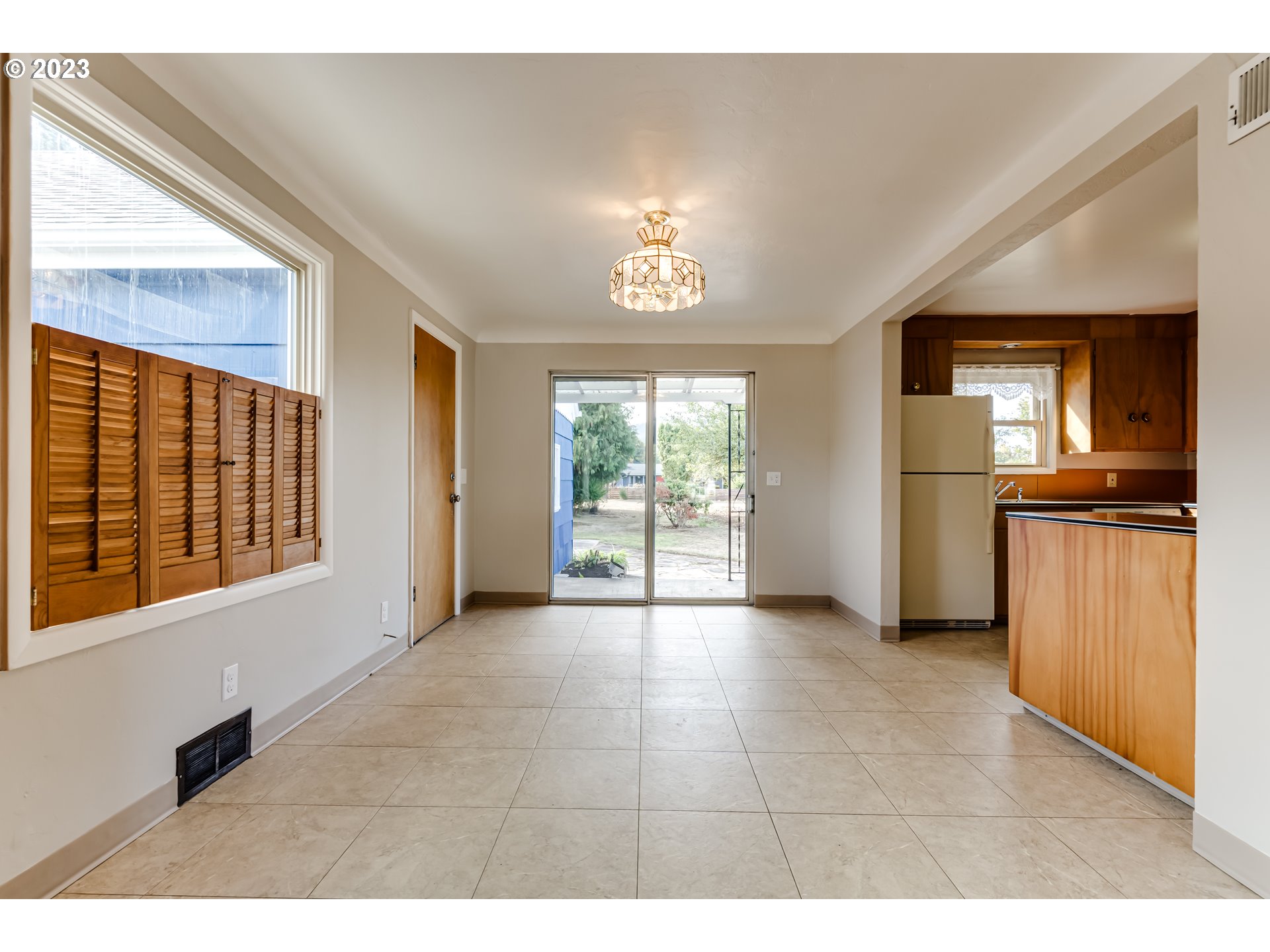 4055 North Street Springfield, OR 97478 - Photo 9 of 48 a view of a kitchen with an entryway and a fireplace