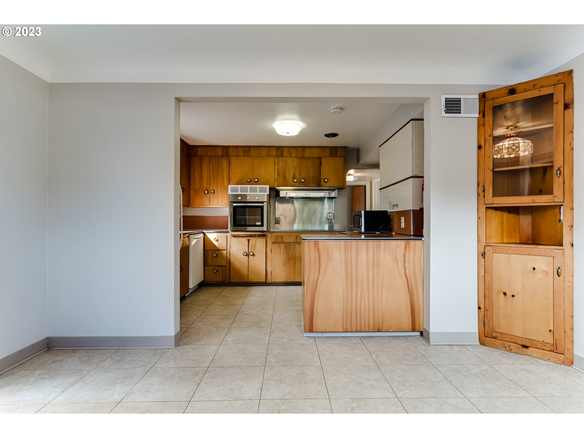 4055 North Street Springfield, OR 97478 - Photo 10 of 48 a kitchen with cabinets and stainless steel appliances