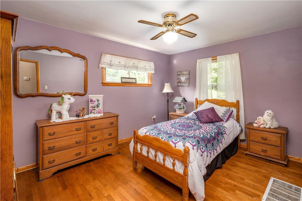939 Fredonia Road Hadley, PA 16130 - Photo 25 of 36 a bedroom with a bed and a chandelier