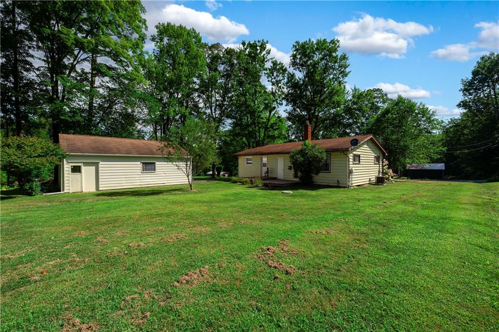 939 Fredonia Road Hadley, PA 16130 - Photo 29 of 36 a view of a house with backyard and garden