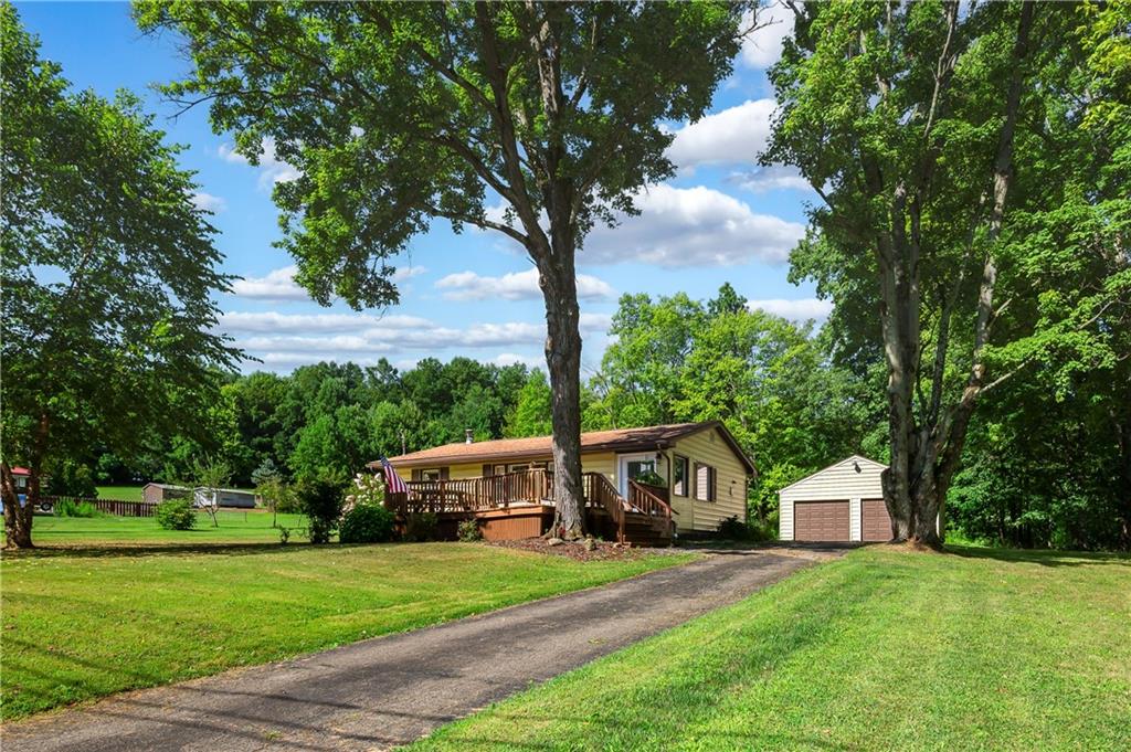 939 Fredonia Road Hadley, PA 16130 - Photo 5 of 36 a front view of a house with a garden