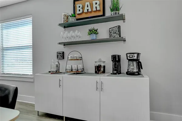 a kitchen with stainless steel appliances granite countertop a sink and a white cabinets