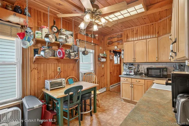 a kitchen with stainless steel appliances granite countertop a sink a stove and cabinets