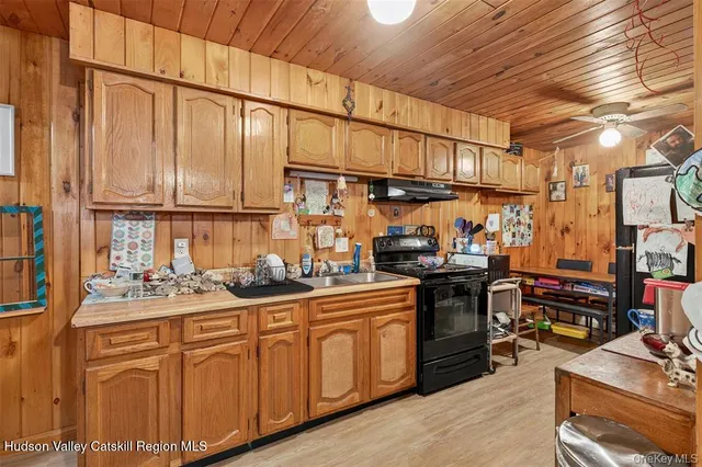 a kitchen with stainless steel appliances granite countertop a sink and cabinets