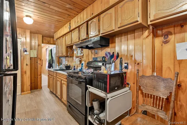 a kitchen with stainless steel appliances granite countertop a stove and a refrigerator