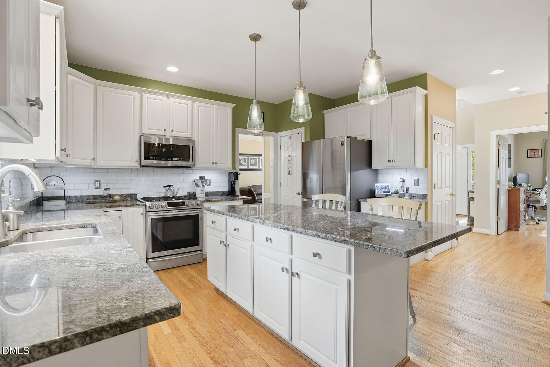 1012 Clatter Avenue Wake Forest, NC 27587 - Photo 14 of 34 a kitchen with stainless steel appliances granite countertop a sink a stove and a refrigerator