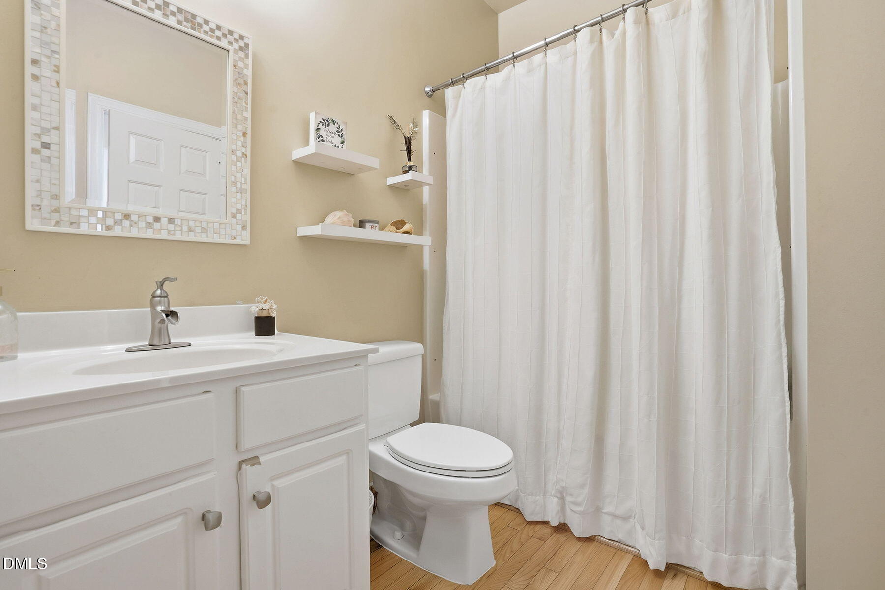 1012 Clatter Avenue Wake Forest, NC 27587 - Photo 17 of 34 a bathroom with a toilet a sink and a window