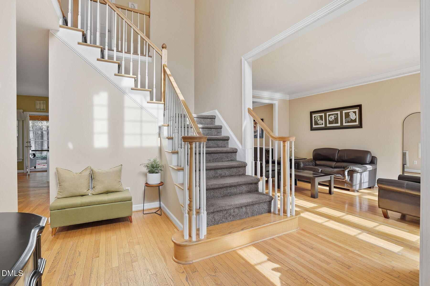 1012 Clatter Avenue Wake Forest, NC 27587 - Photo 3 of 34 a living room with wooden floor and a dining table