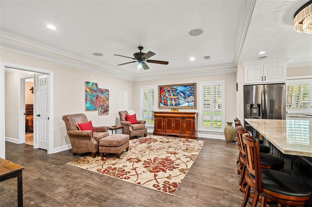 400 Hunters Ridge Circle Coppell, TX 75019 - Photo 10 of 35 a living room with furniture and a flat screen tv