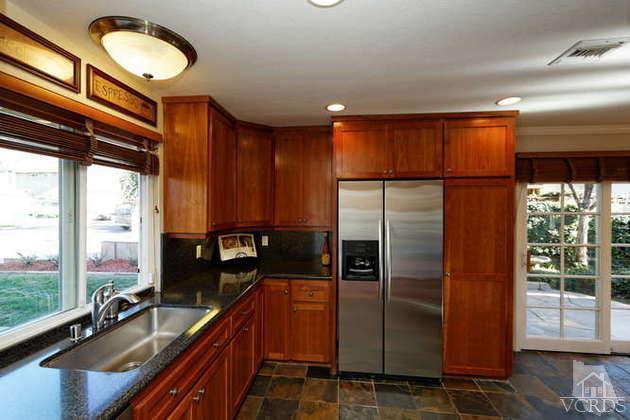 741 Appleton Road Simi Valley, CA 93065 - Photo 2 of 22 a kitchen with kitchen island granite countertop a refrigerator and a sink
