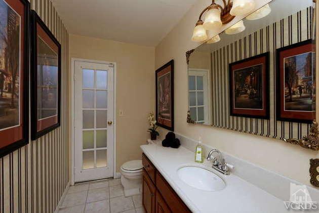 741 Appleton Road Simi Valley, CA 93065 - Photo 11 of 22 a bathroom with a sink a vanity and a mirror