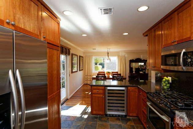 741 Appleton Road Simi Valley, CA 93065 - Photo 8 of 22 a kitchen with stainless steel appliances a refrigerator and a stove top oven