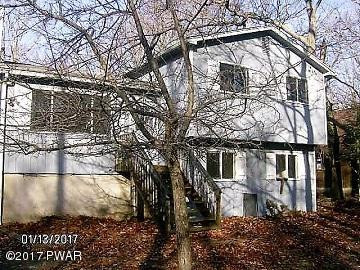 a house with trees in front of it
