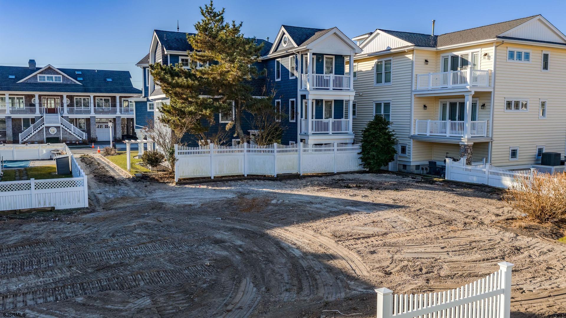 210 Gull Road Ocean City, NJ 08226 - Photo 26 of 34 a view of a white house with a yard and sitting area