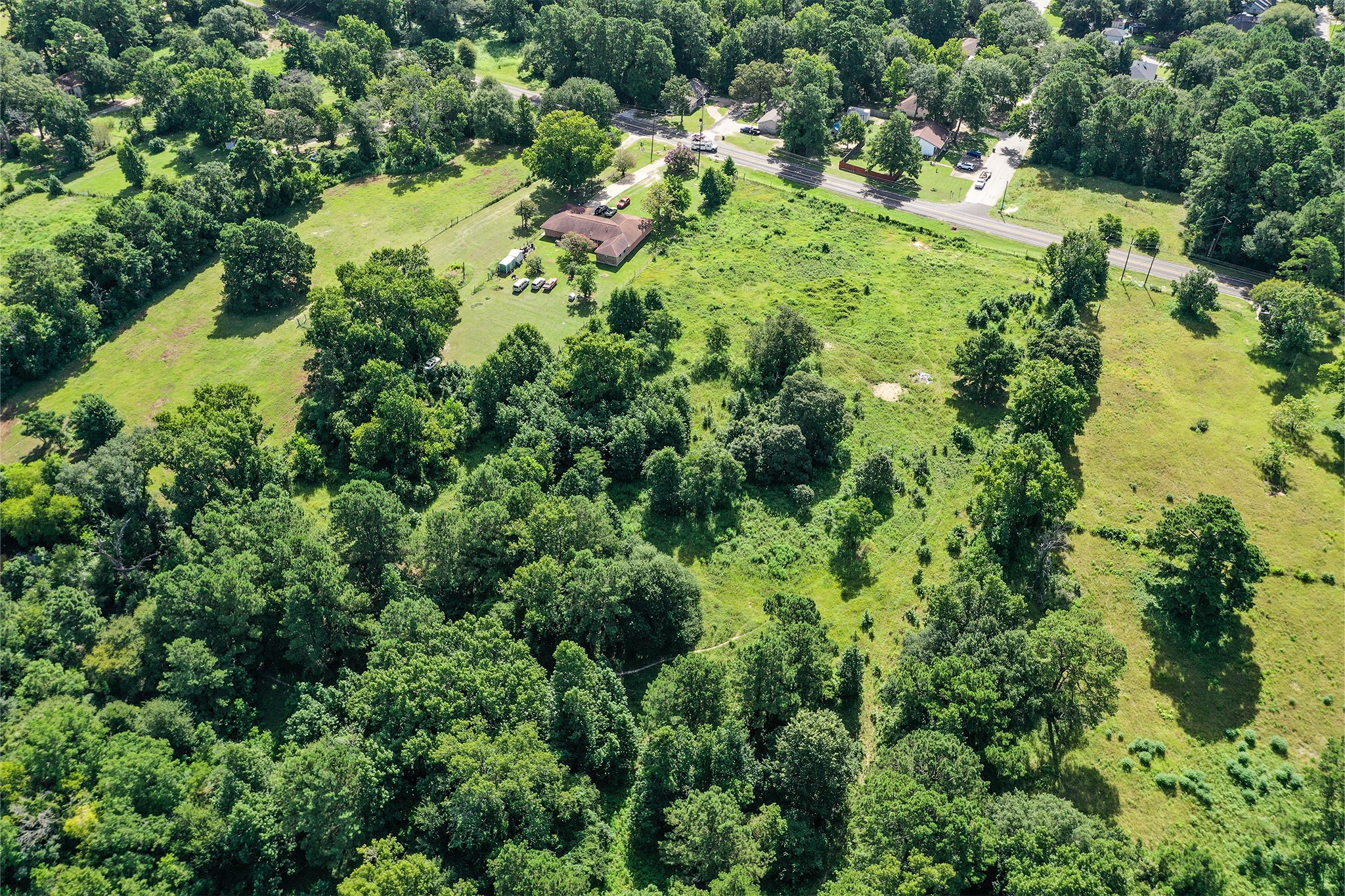 3722 Montgomery Road Huntsville, TX 77340 - Photo 12 of 16 an aerial view of residential house with outdoor space and trees all around