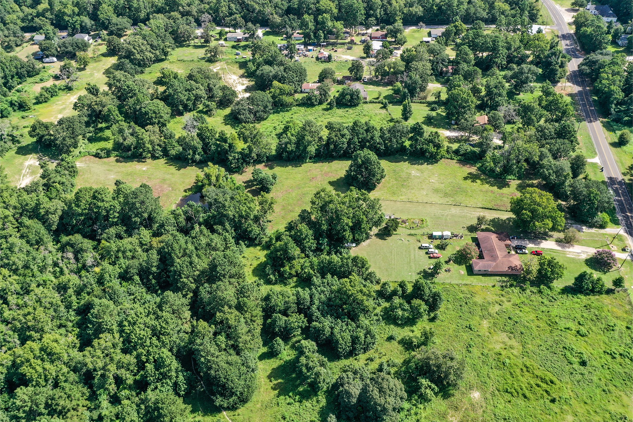3722 Montgomery Road Huntsville, TX 77340 - Photo 14 of 16 an aerial view of residential house with outdoor space and lake view