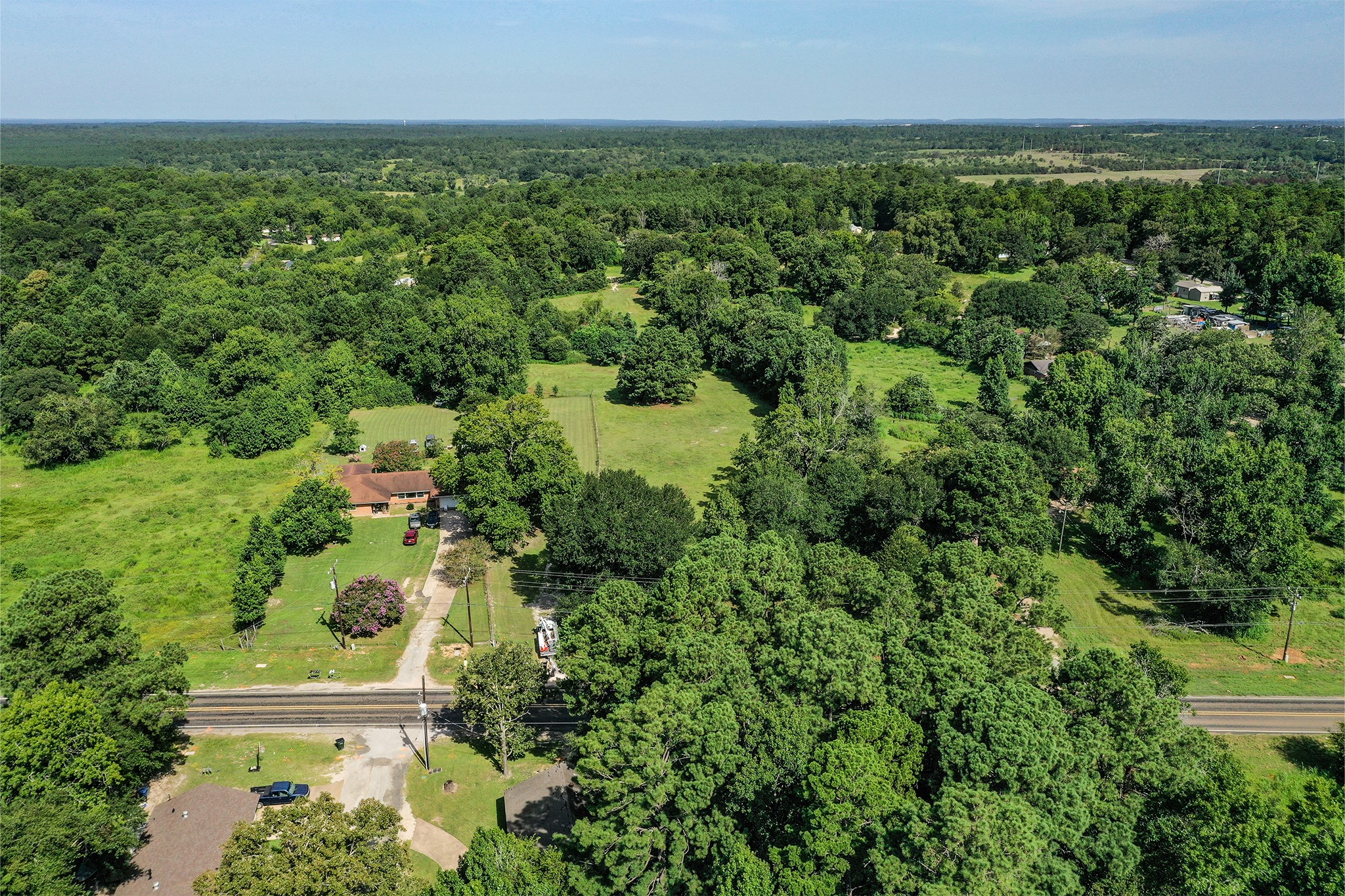 3722 Montgomery Road Huntsville, TX 77340 - Photo 3 of 16 an aerial view of residential houses with outdoor space and trees