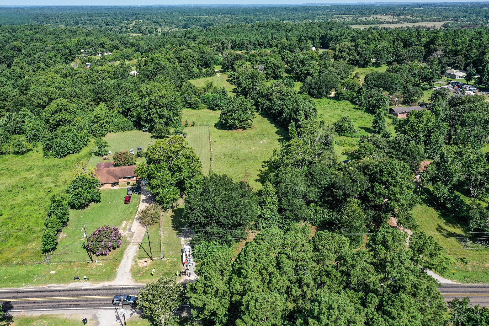 3722 Montgomery Road Huntsville, TX 77340 - Photo 4 of 16 an aerial view of residential house with outdoor space and trees all around