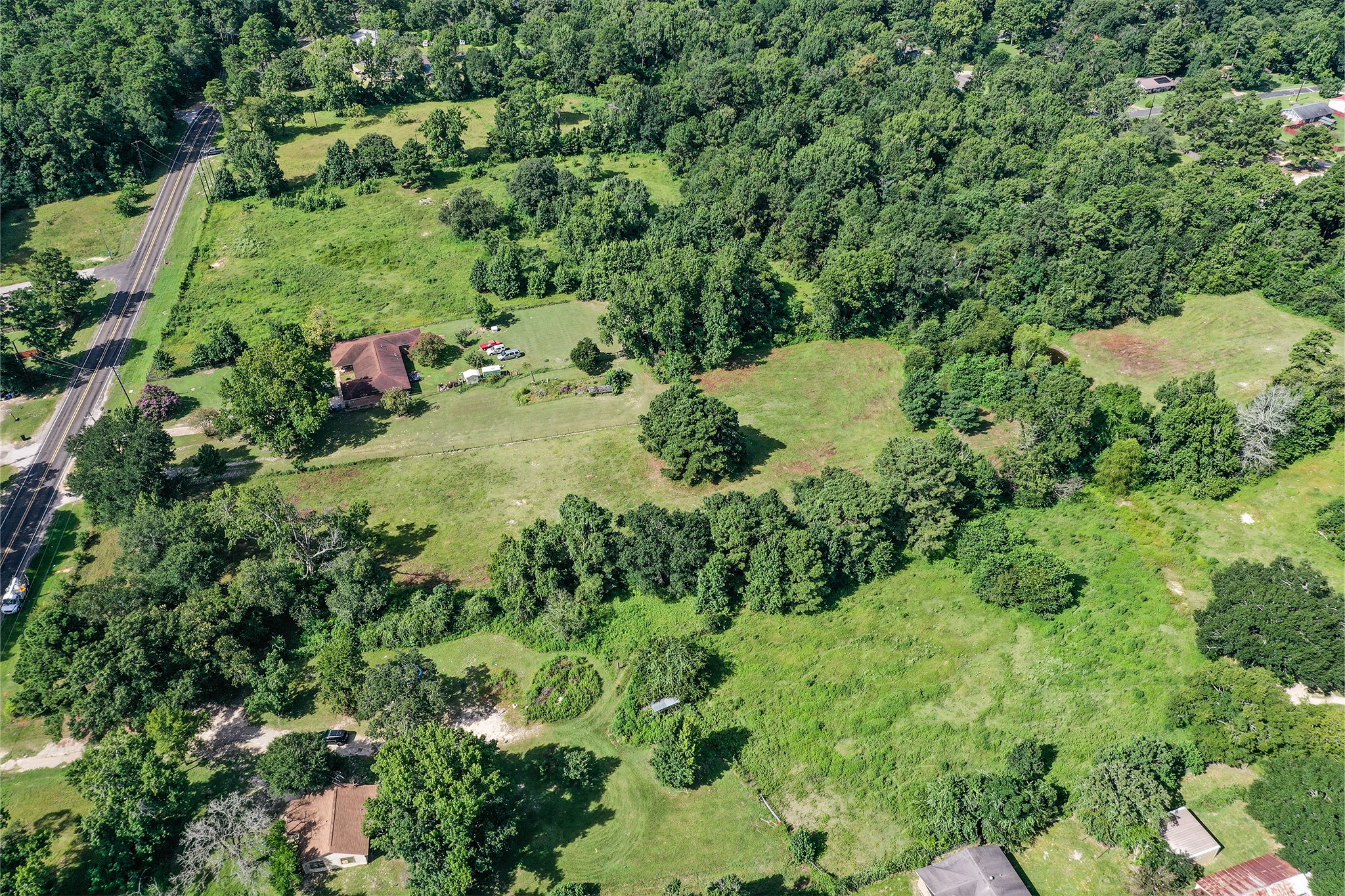 3722 Montgomery Road Huntsville, TX 77340 - Photo 7 of 16 an aerial view of residential house with outdoor space and trees all around