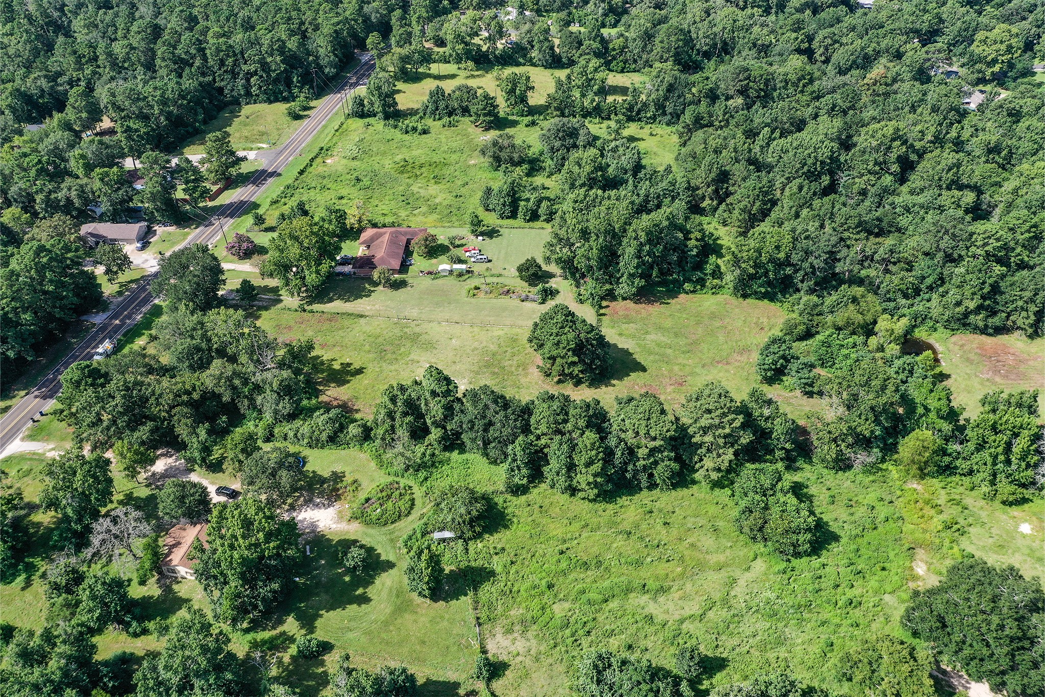 3722 Montgomery Road Huntsville, TX 77340 - Photo 8 of 16 a view of a forest with a houses