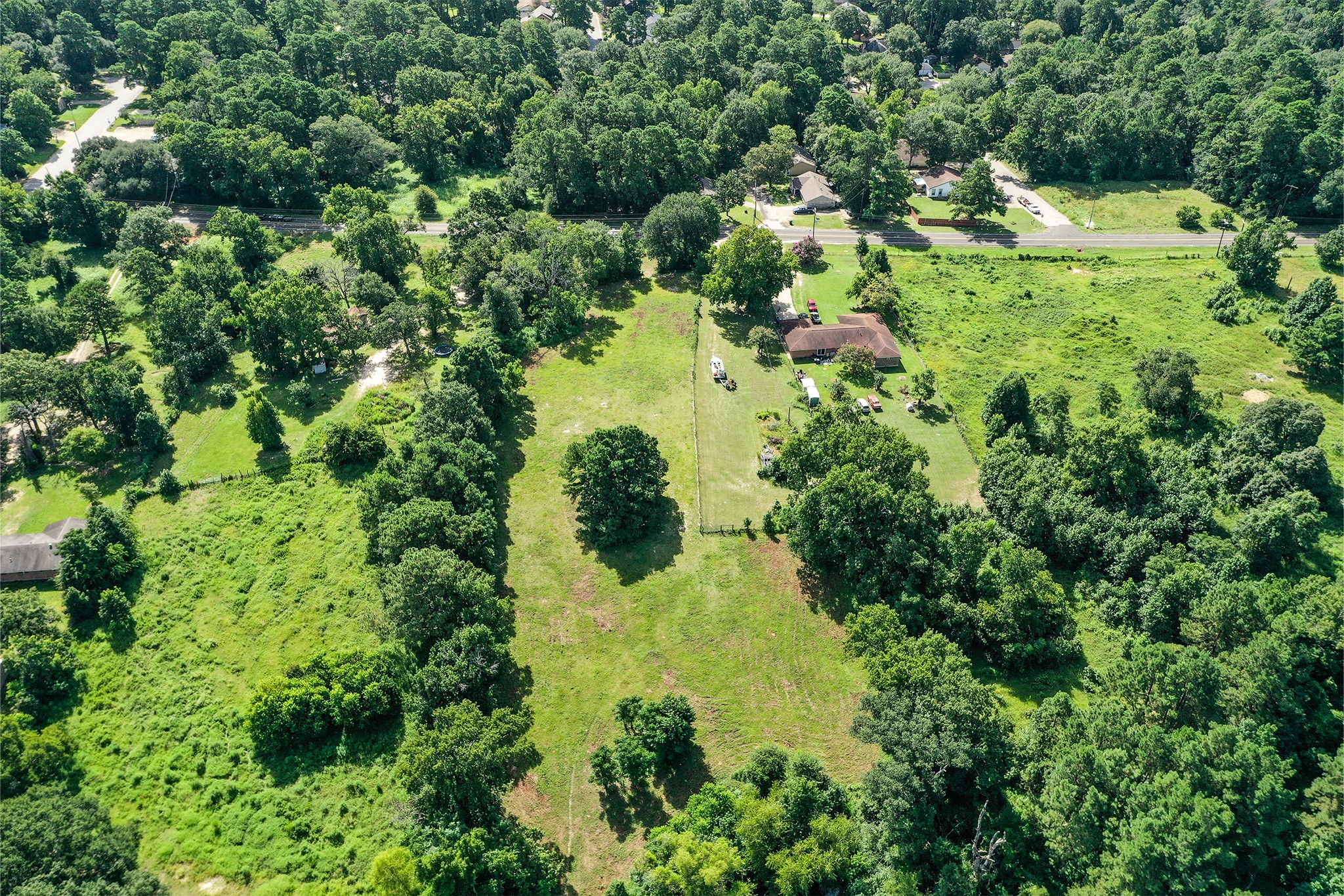 3722 Montgomery Road Huntsville, TX 77340 - Photo 10 of 16 an aerial view of residential house with outdoor space and trees all around