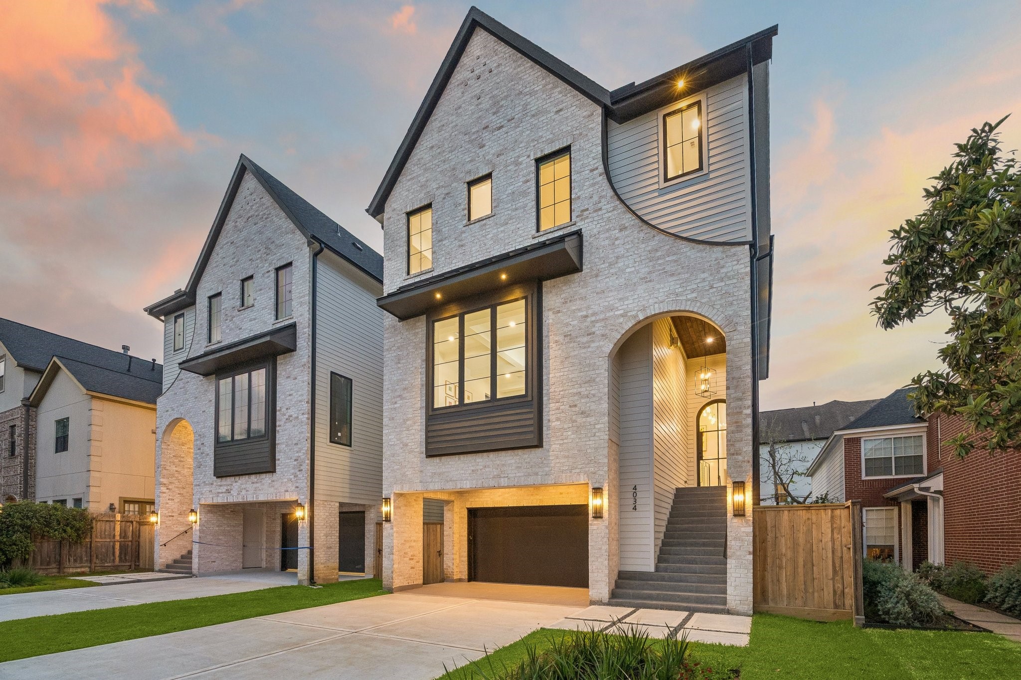 4034 Lanark Lane Houston, TX 77025 - Photo 1 of 32 Another fantastic development from Prebisch Homes! This striking pair of Transitional residences feature a clean, symmetrical design with timeless architectural appeal. The facades are clad in Antique White Queen Brick, accented by dark trim and steep gabled rooflines. Large, black-framed windows punctuate the exterior, allowing abundant natural light while creating bold contrast against the light masonry.