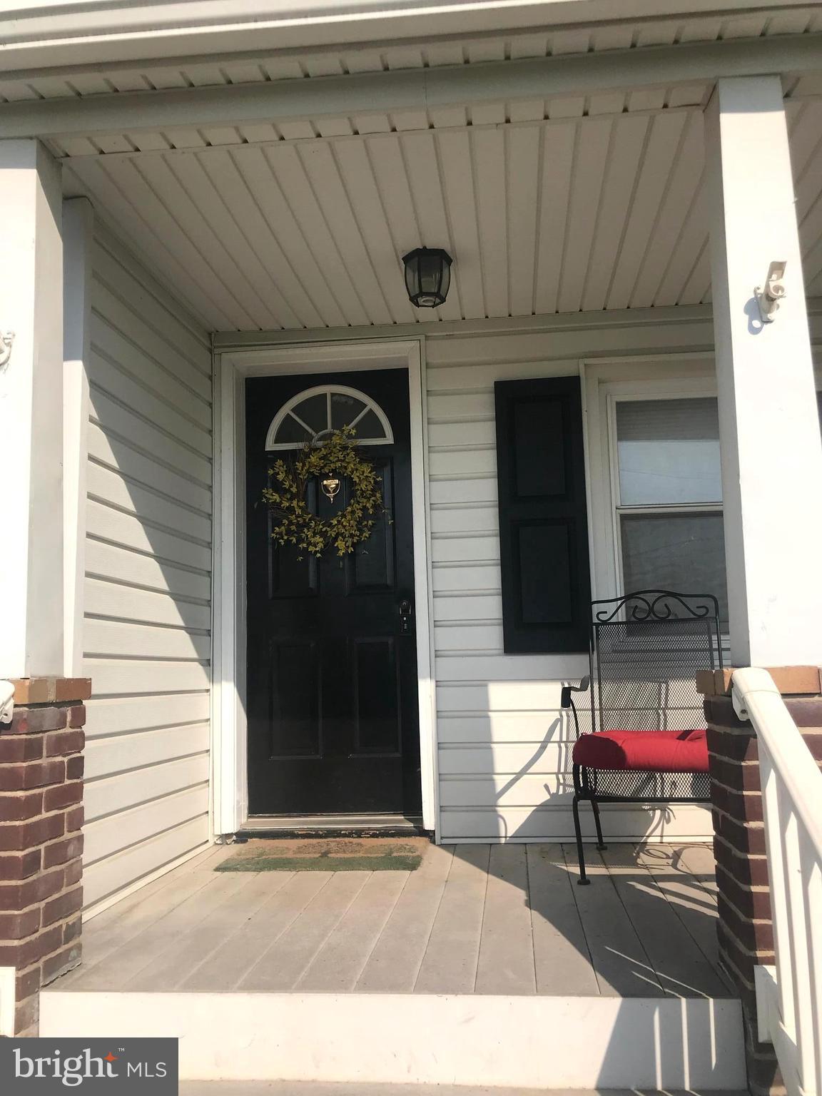 113 South Lightner Street Union Bridge, MD 21791 - Photo 6 of 20 a view of a porch with furniture and floor to ceiling window