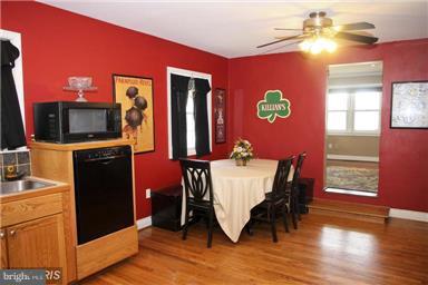113 South Lightner Street Union Bridge, MD 21791 - Photo 8 of 20 a view of a dining room with furniture window and wooden floor
