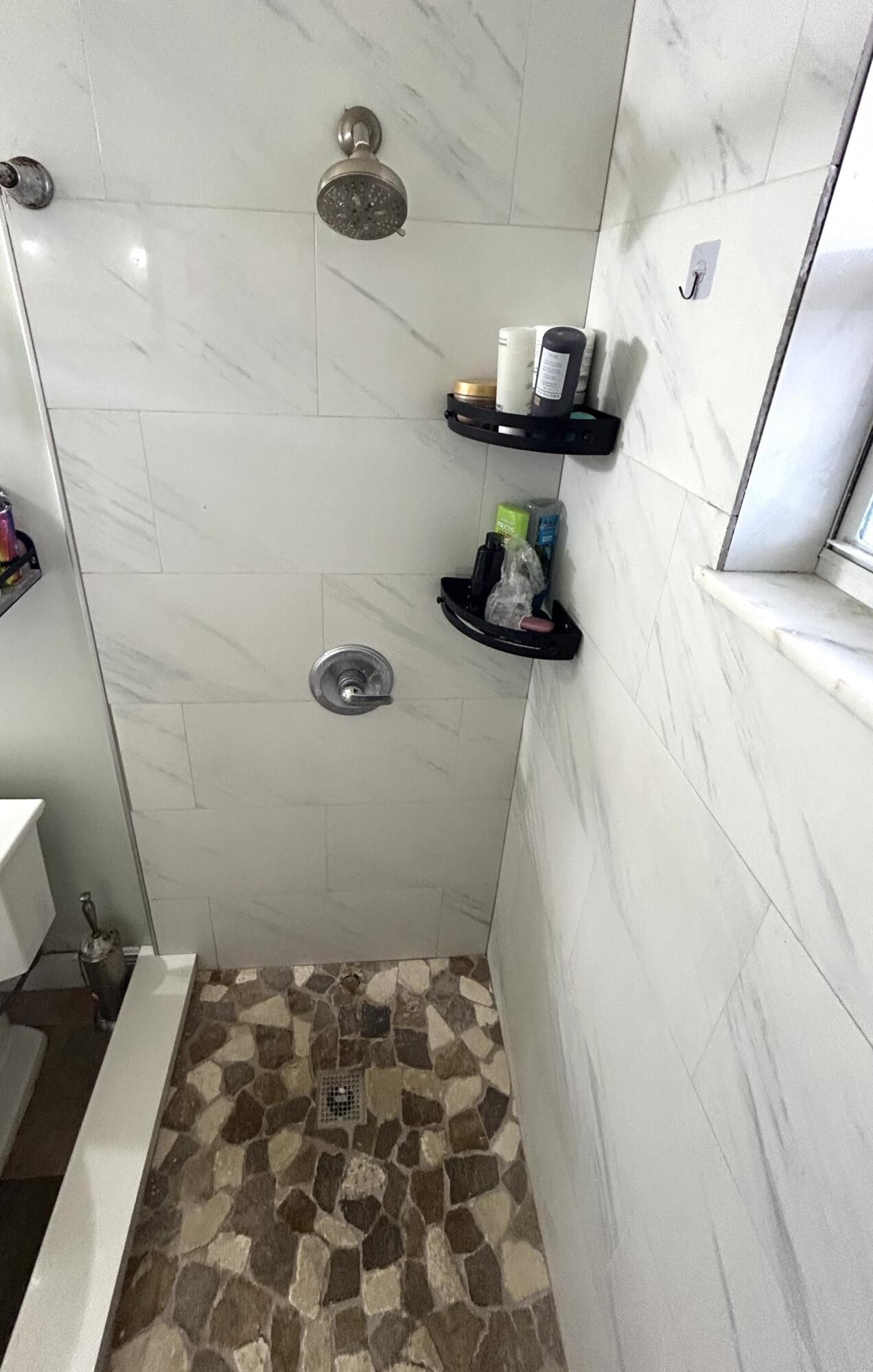 506 Davis Road, Unit 66 Palm Springs, FL 33461 - Photo 14 of 26 a bathroom with a sink and a mirror