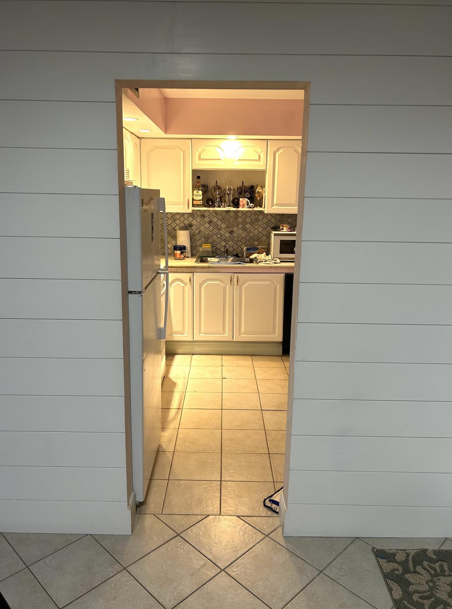 506 Davis Road, Unit 66 Palm Springs, FL 33461 - Photo 16 of 26 a view of open kitchen with granite countertop cabinets