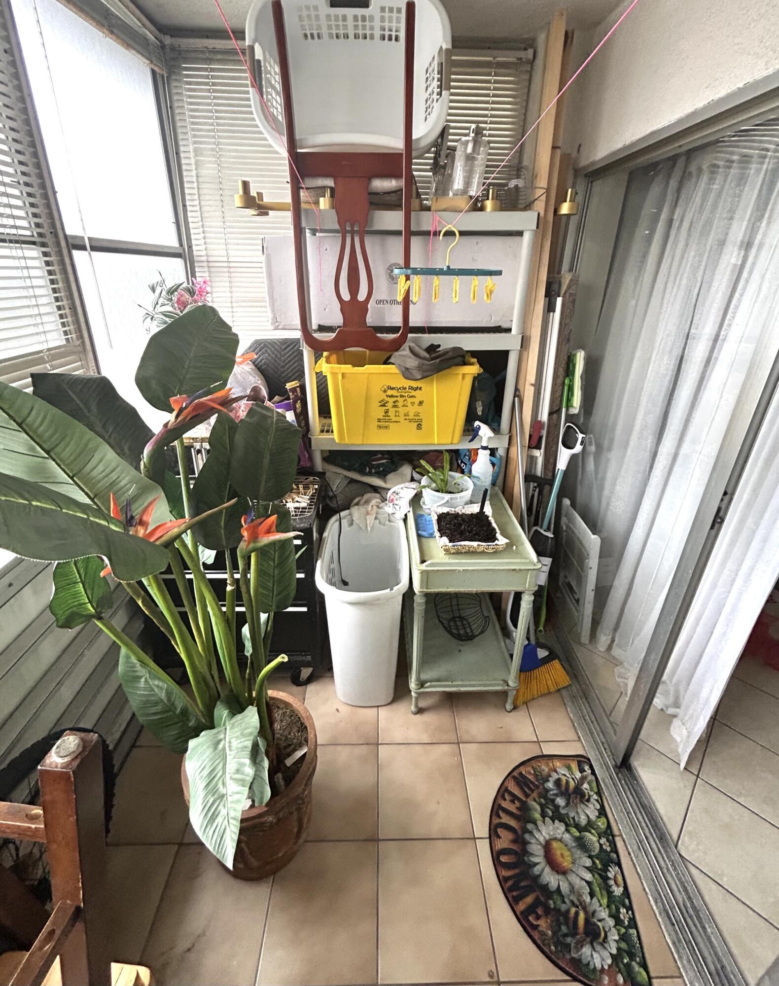 506 Davis Road, Unit 66 Palm Springs, FL 33461 - Photo 21 of 26 a vase of flowers sitting on a table