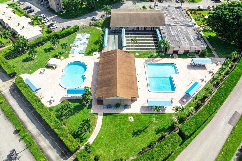 506 Davis Road, Unit 66 Palm Springs, FL 33461 - Photo 23 of 26 an aerial view of a house with a garden and plants
