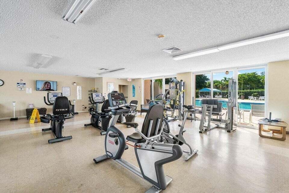 506 Davis Road, Unit 66 Palm Springs, FL 33461 - Photo 25 of 26 a view of a room with gym equipment