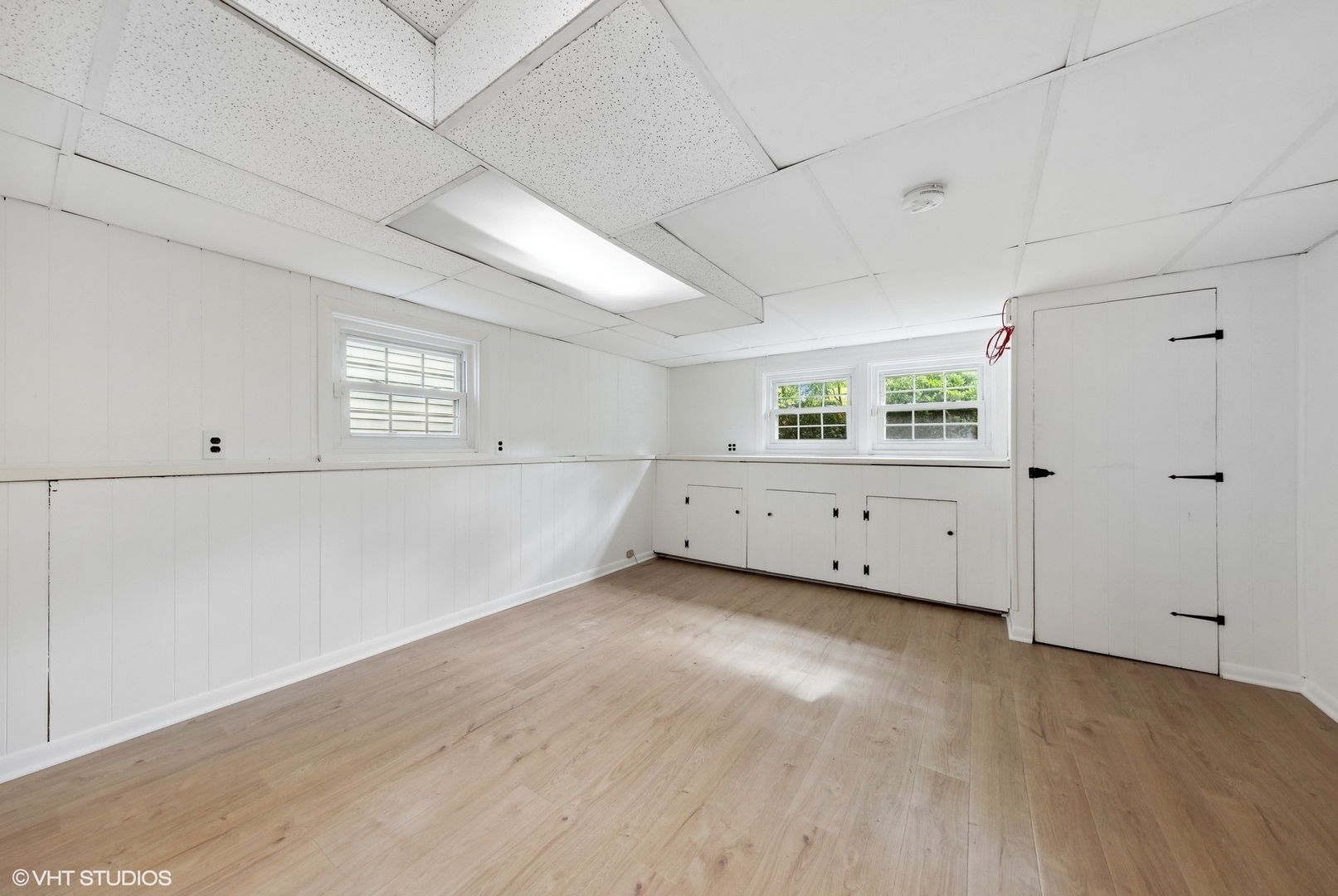 Undisclosed Address Western Springs, IL 60558 - Photo 13 of 15 a view of an empty room with wooden floor and windows