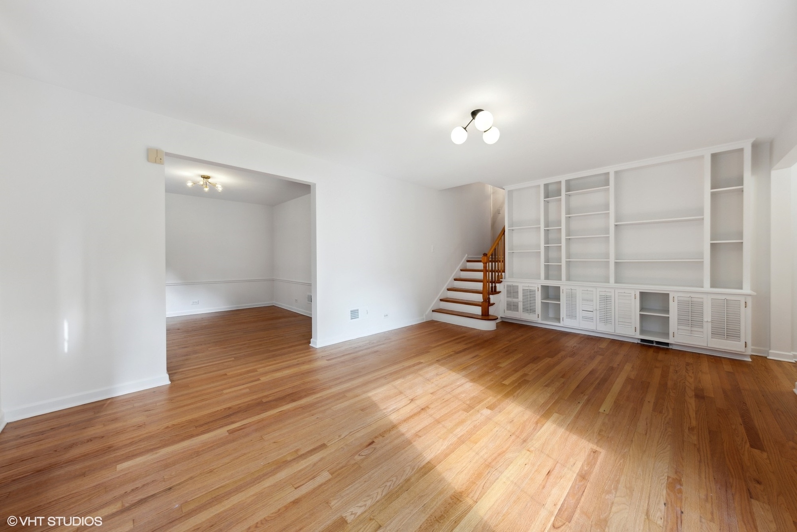 Undisclosed Address Western Springs, IL 60558 - Photo 3 of 15 an empty room with wooden floor and white walls