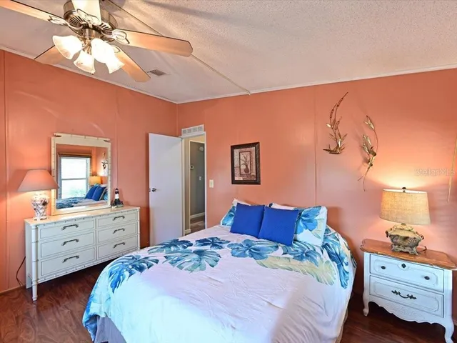 a bedroom with a bed and a dresser