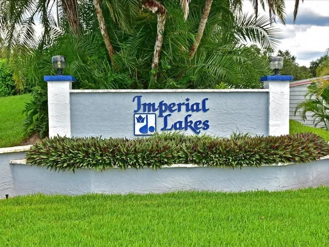 a wooden sign on the side of the road