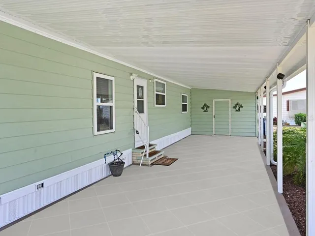 a spacious bathroom with a double vanity sink and a mirror