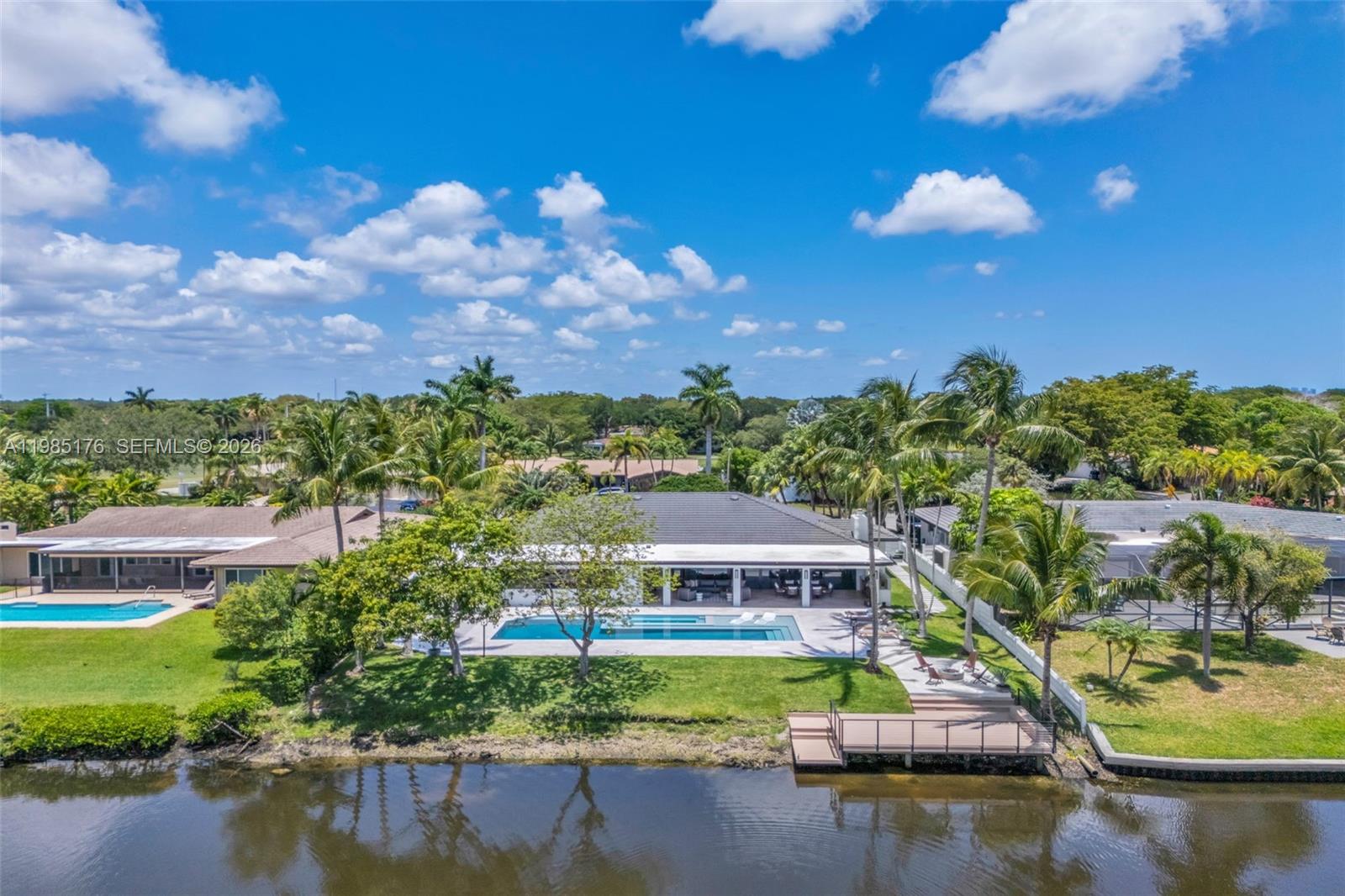 4430 Casper Court Hollywood, FL 33021 - Photo 53 of 64 a view of houses with swimming pool and outdoor seating