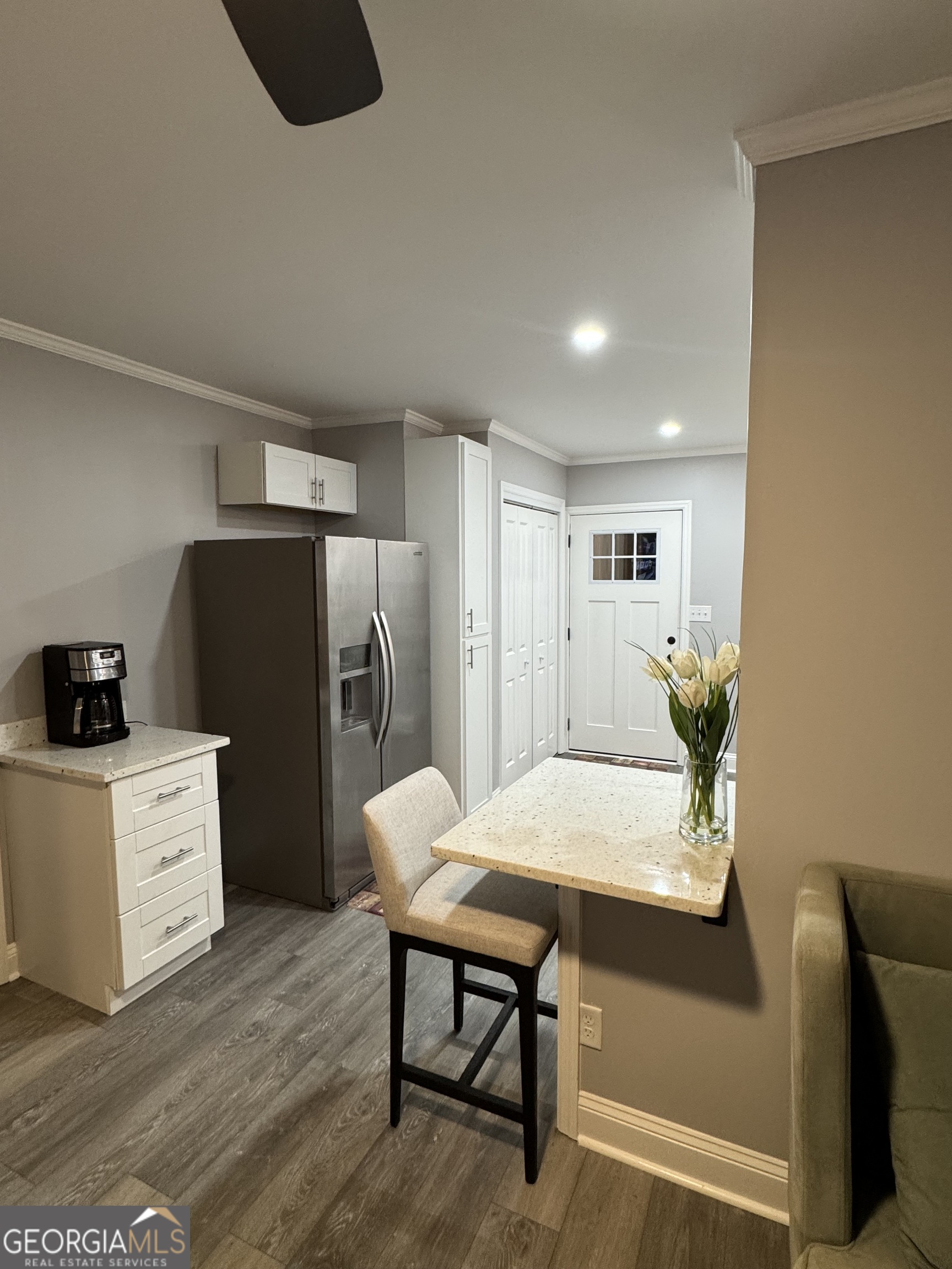 339 North Gray Street Millen, GA 30442 - Photo 7 of 16 a living room with furniture and a refrigerator