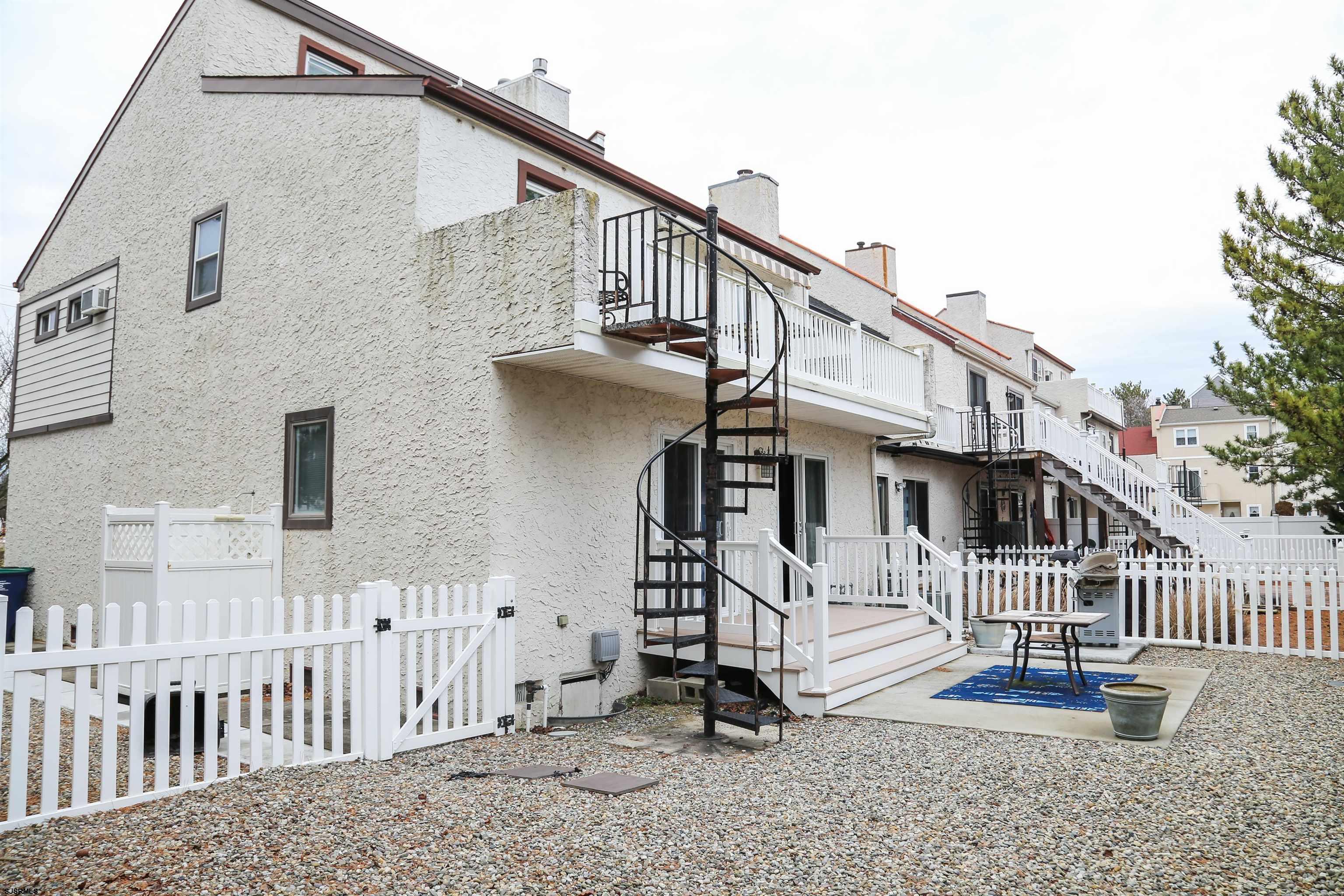 4818 Harbor Beach Boulevard Brigantine, NJ 08203 - Photo 24 of 30 a view of a house with a small yard and stairs