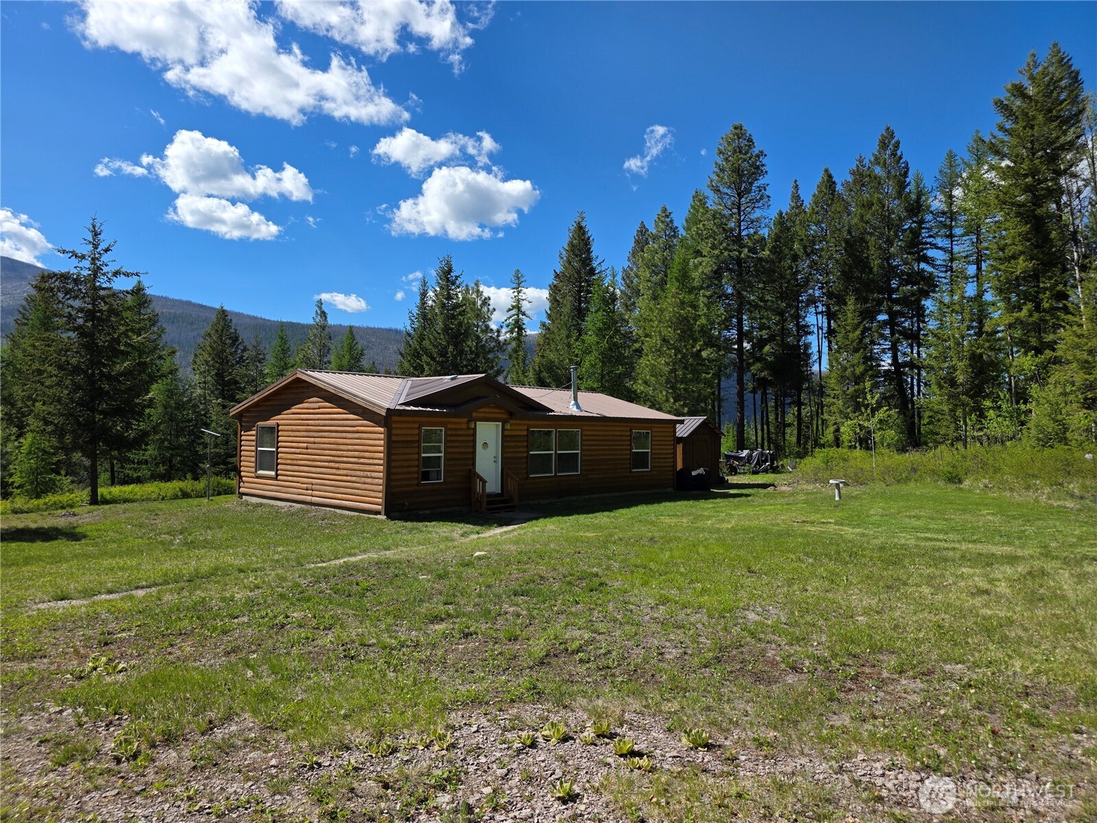 393 Summer Road Tonasket, WA 98855 - Photo 15 of 37 a view of a house with a yard