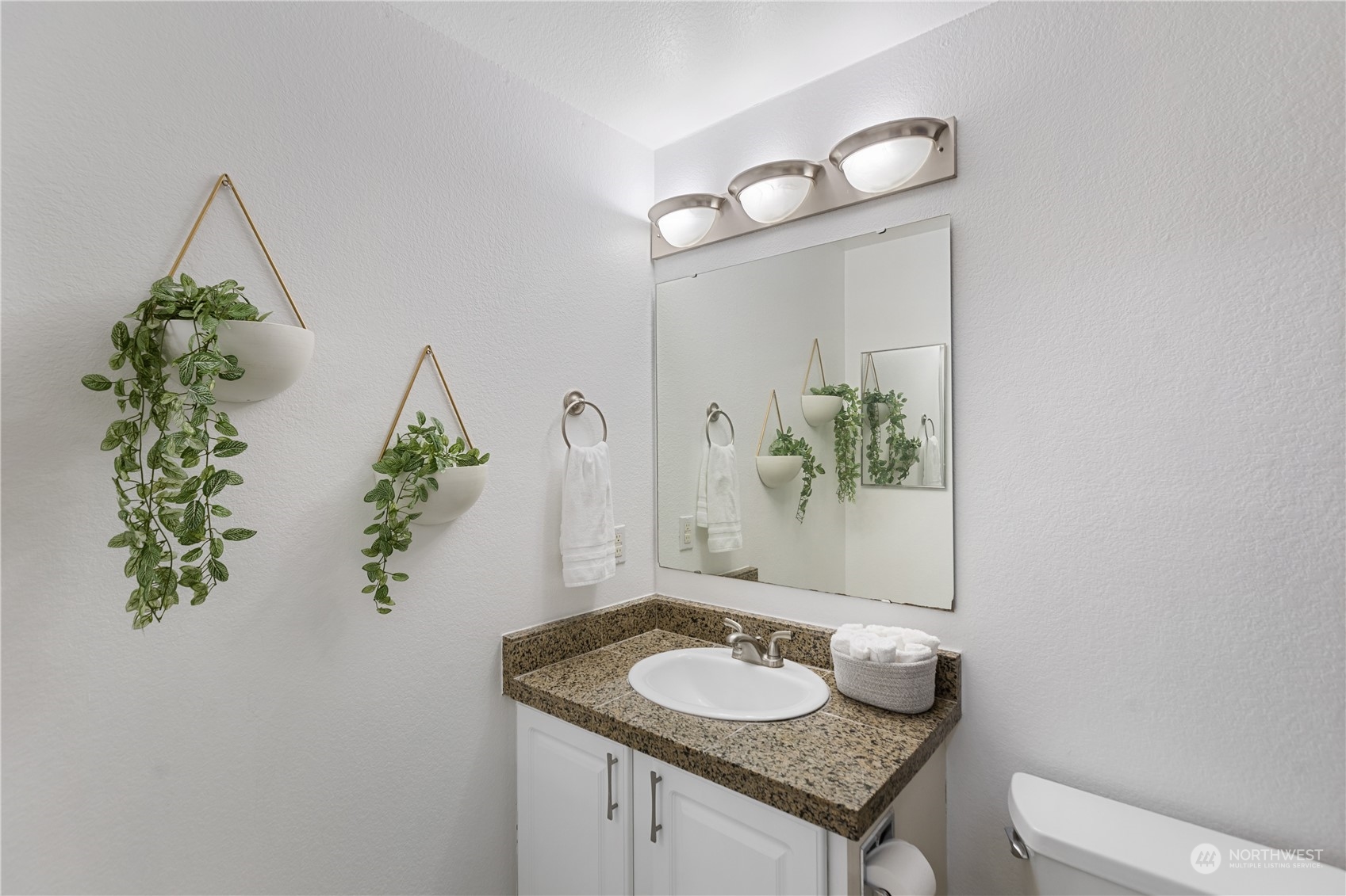 412 Center Road, Unit E2 Everett, WA 98204 - Photo 13 of 18 a bathroom with a granite countertop sink and a mirror