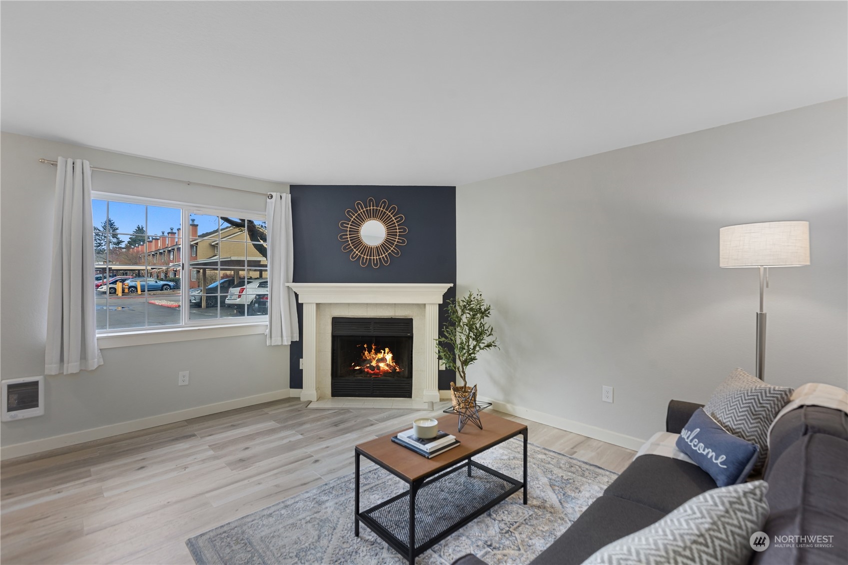 412 Center Road, Unit E2 Everett, WA 98204 - Photo 2 of 18 a living room with furniture and a fireplace