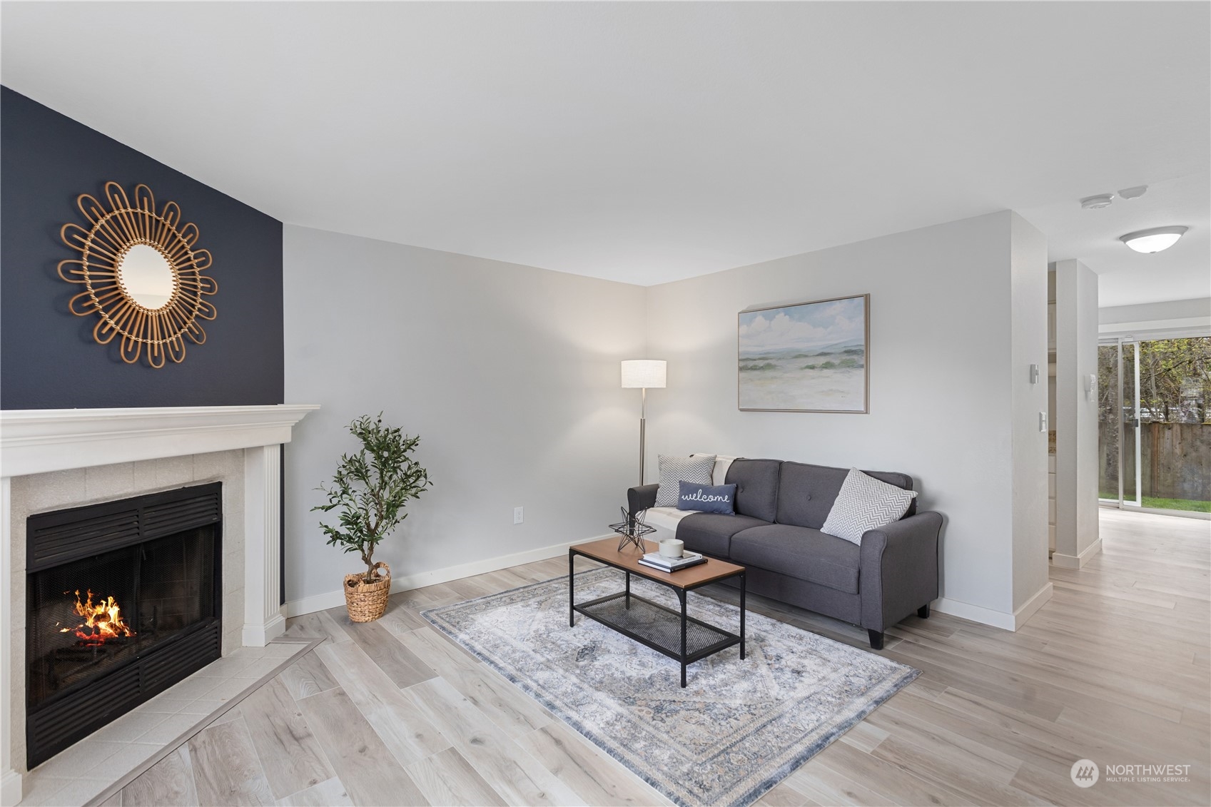 412 Center Road, Unit E2 Everett, WA 98204 - Photo 3 of 18 a living room with furniture and a fireplace