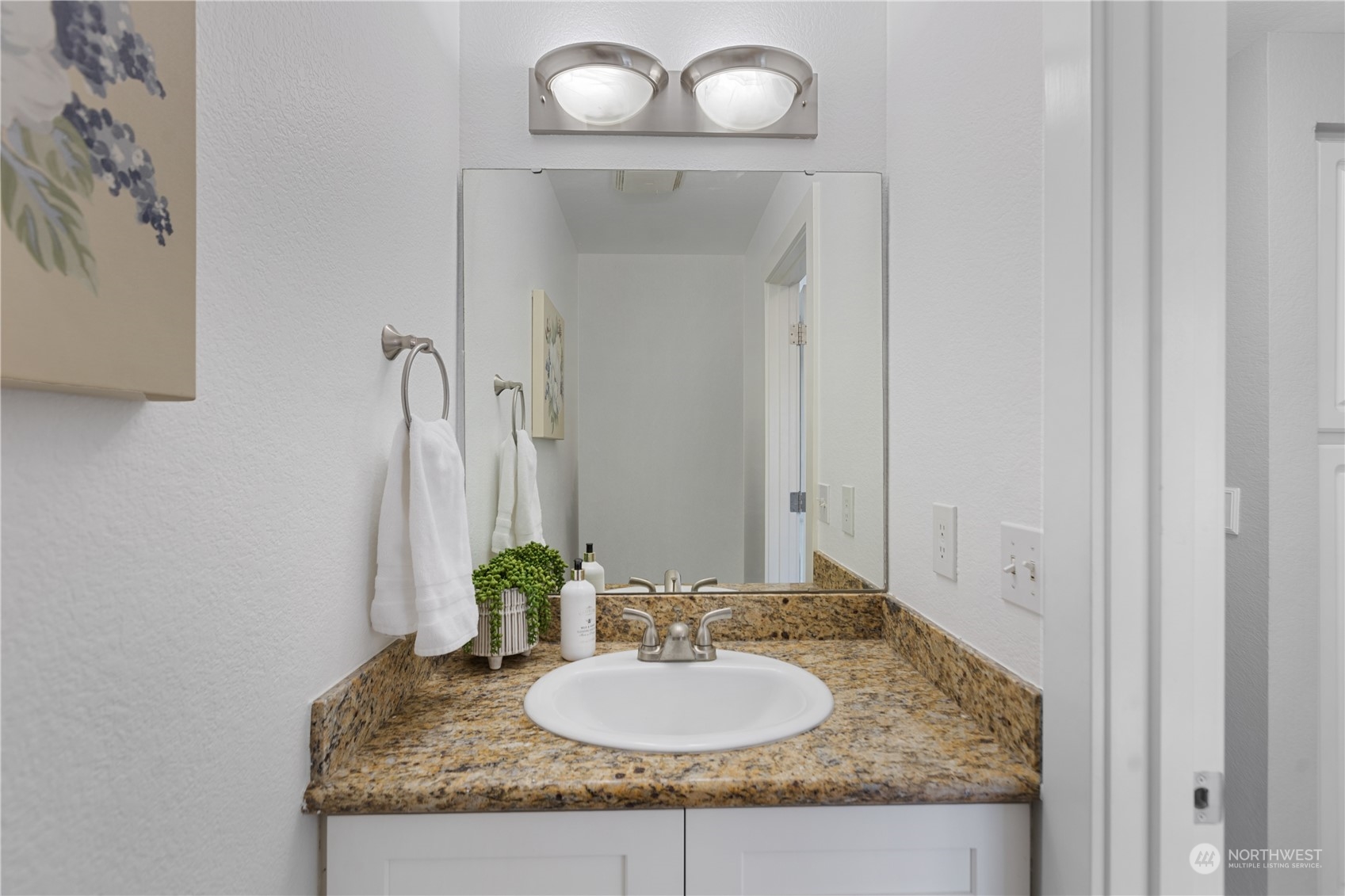 412 Center Road, Unit E2 Everett, WA 98204 - Photo 9 of 18 a bathroom with a granite countertop sink and a mirror