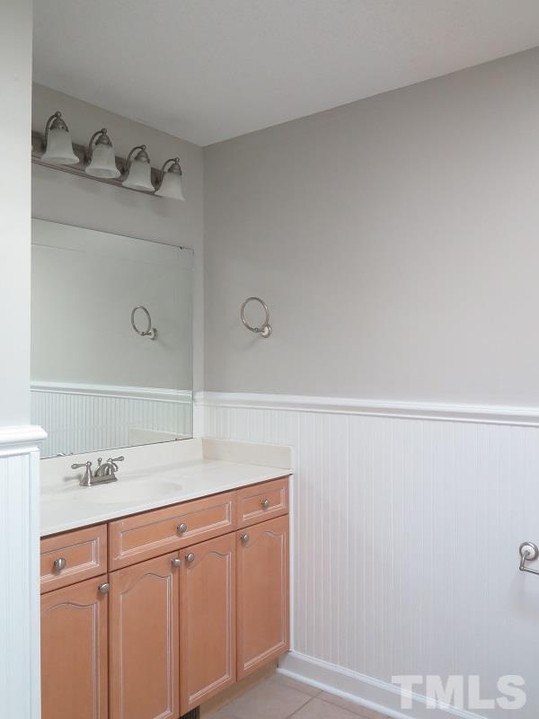 7617 Harps Mill Road Raleigh, NC 27615 - Photo 17 of 24 a bathroom with a sink and vanity
