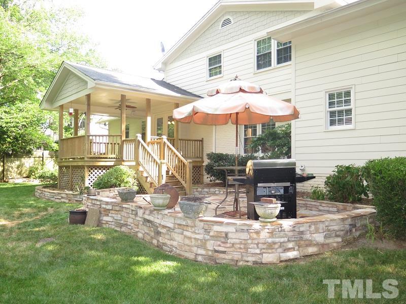 7617 Harps Mill Road Raleigh, NC 27615 - Photo 21 of 24 a view of a house with backyard porch and sitting area