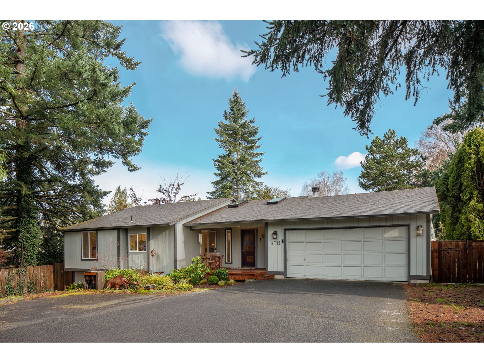 4721 Southwest 45th Avenue Portland, OR 97221 - Photo 1 of 29 a front view of a house with a yard