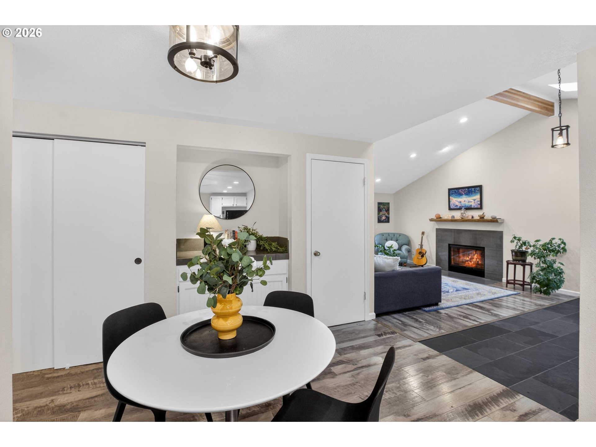 4721 Southwest 45th Avenue Portland, OR 97221 - Photo 13 of 29 a dining room with furniture and a fireplace